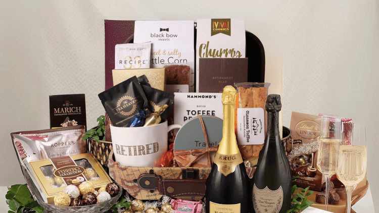 retirement collect of gift baskets and boxes. Gifts featuring retirement and travel gifts for women and men filled with snacks, champagne and chocolates