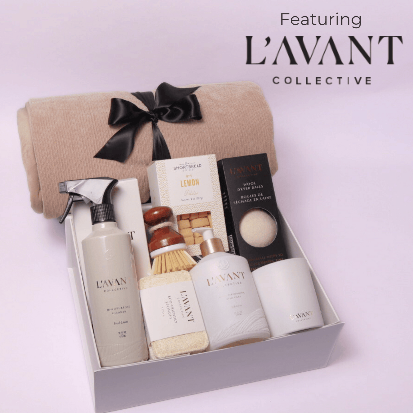 Luxury gift box featuring Seattle based Lavant collective luxury home products. This luxury high end gift box includes: multipurpose cleaner, scrub brush, dish soap, candle, dryer balls, cookies and a luxe cream cozy throw.