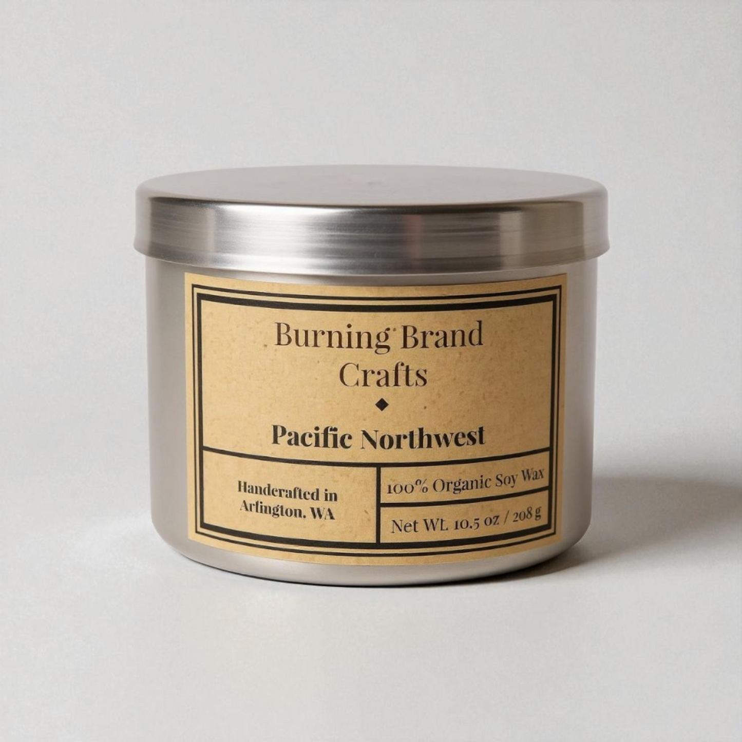 Candle jar with 'Burning Brand Crafts' label on a light gray background pacific northwest scented