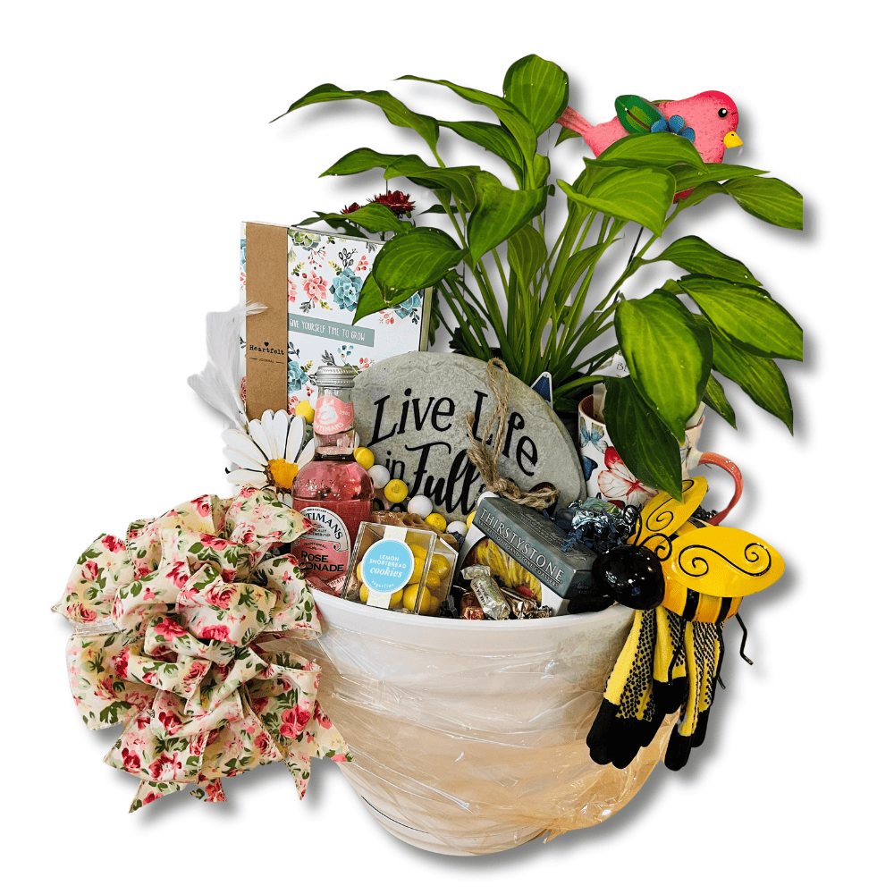 retirement gardener gift basket included a live plant, garden journal, gloves, decor, coasters, cookies and lemonade wrapped with a floral bow in a planter