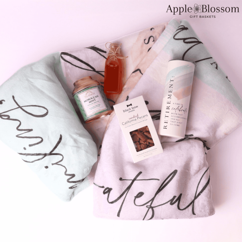 Alternate Angle with Items Displayed
Angled view of retirement gift basket with blanket, tumbler, tea, pecans, honey, and keepsake box—stylish and meaningful gift for women.
