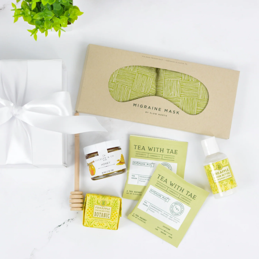Stress Relief Gift Box with herbal tea sachets, honey, therapeutic eye pillow, and spa essentials in white gift packaging