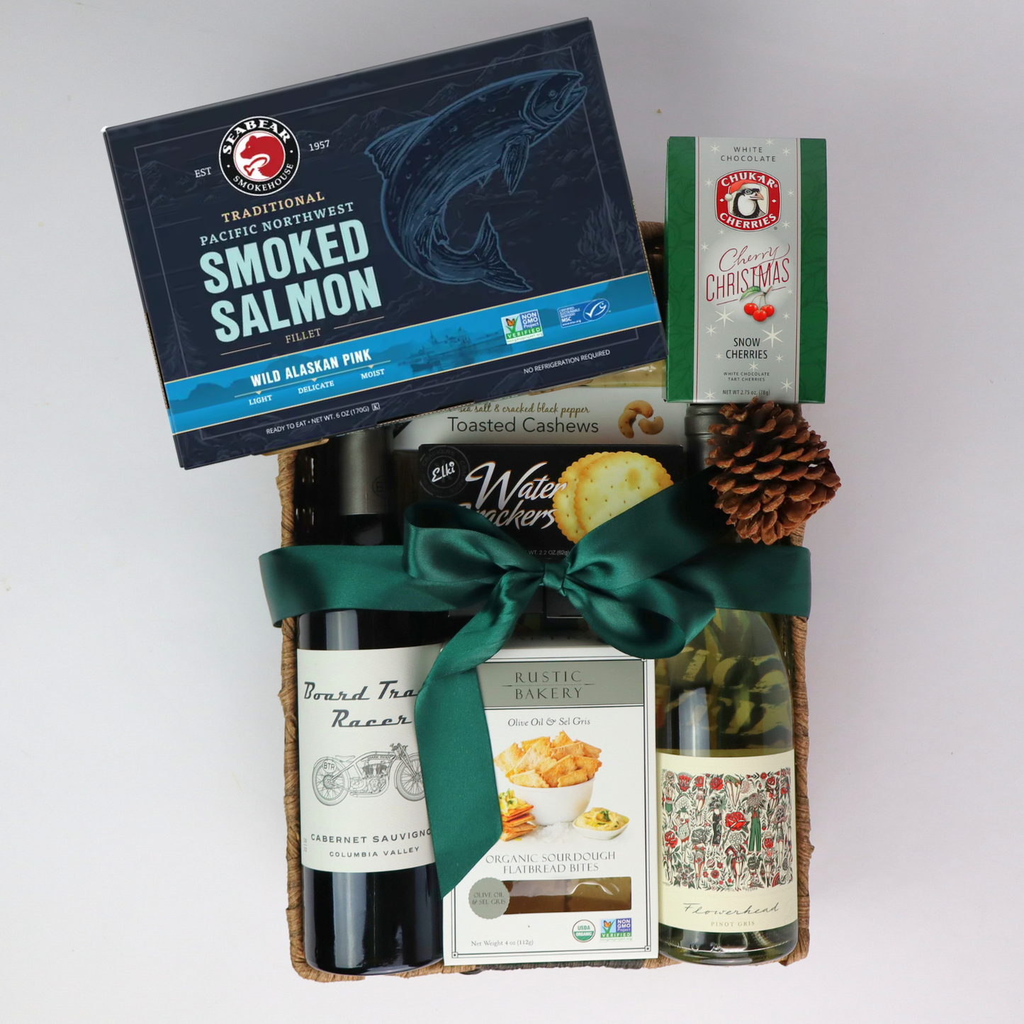 the best wine Gift basket with smoked salmon, wine, cheese and other snacks on a white background