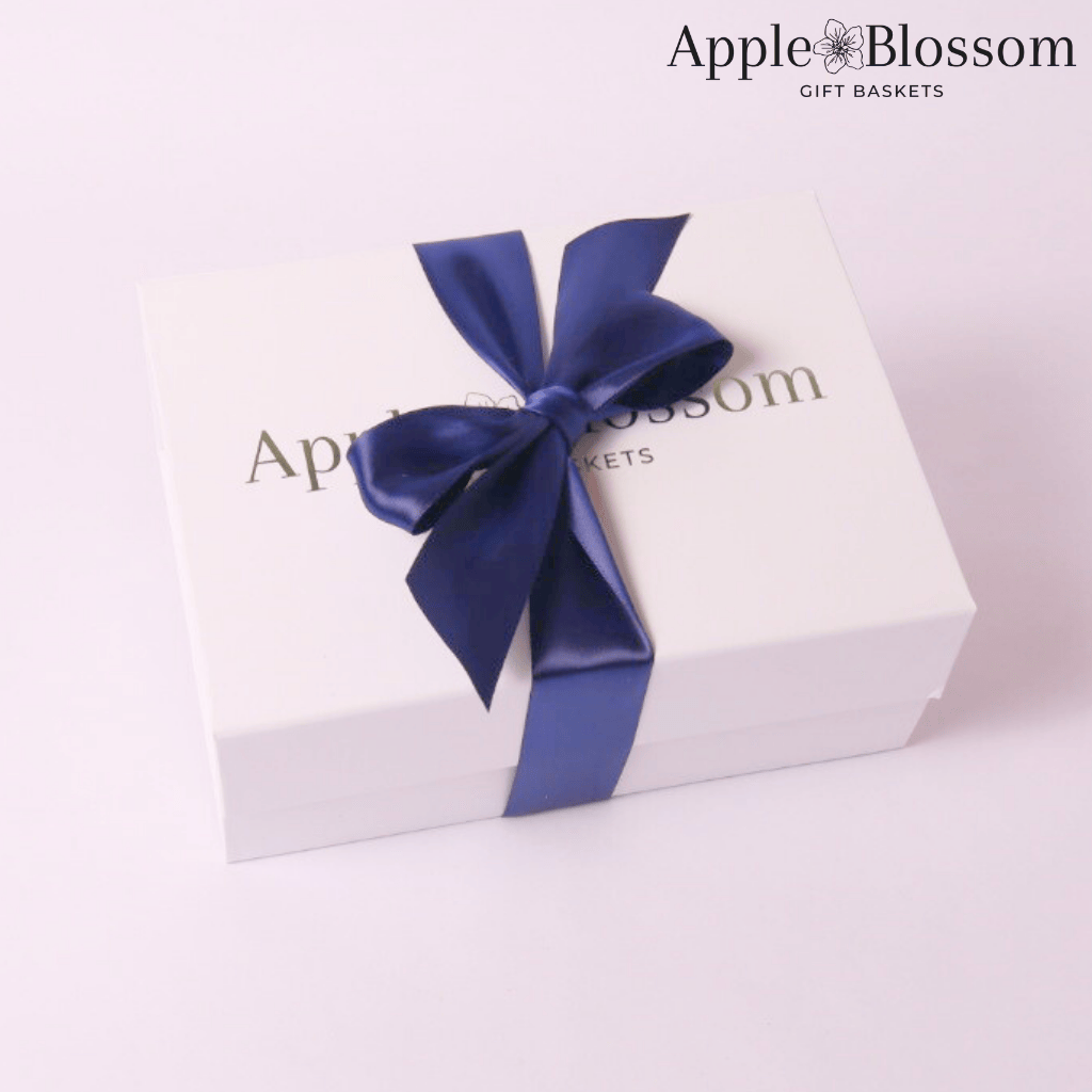 Closed gift box with a blue bow, elegantly wrapped for a professional and thoughtful corporate gifting experience.