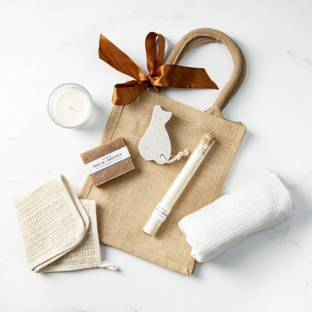 Collection of gifts for her featuring spa gift baskets, self care and indulgent snacks