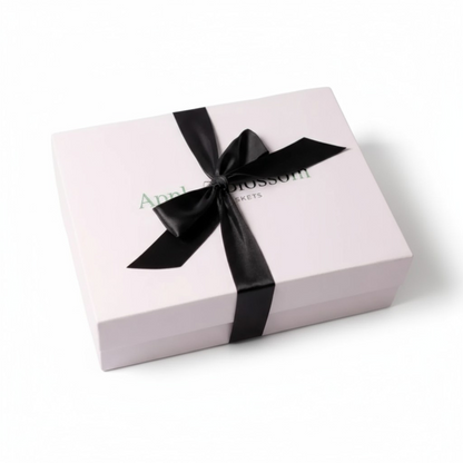 white apple blossom gift baskets signature luxe gift box with a satin red bow.