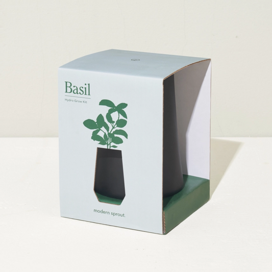 Indoor basil grow kit with self-watering glass planter. Includes organic non-GMO seeds, grow medium, plant food, and instructions. Great for kitchen gift baskets, sympathy gifts, or plant mom holiday gifts.