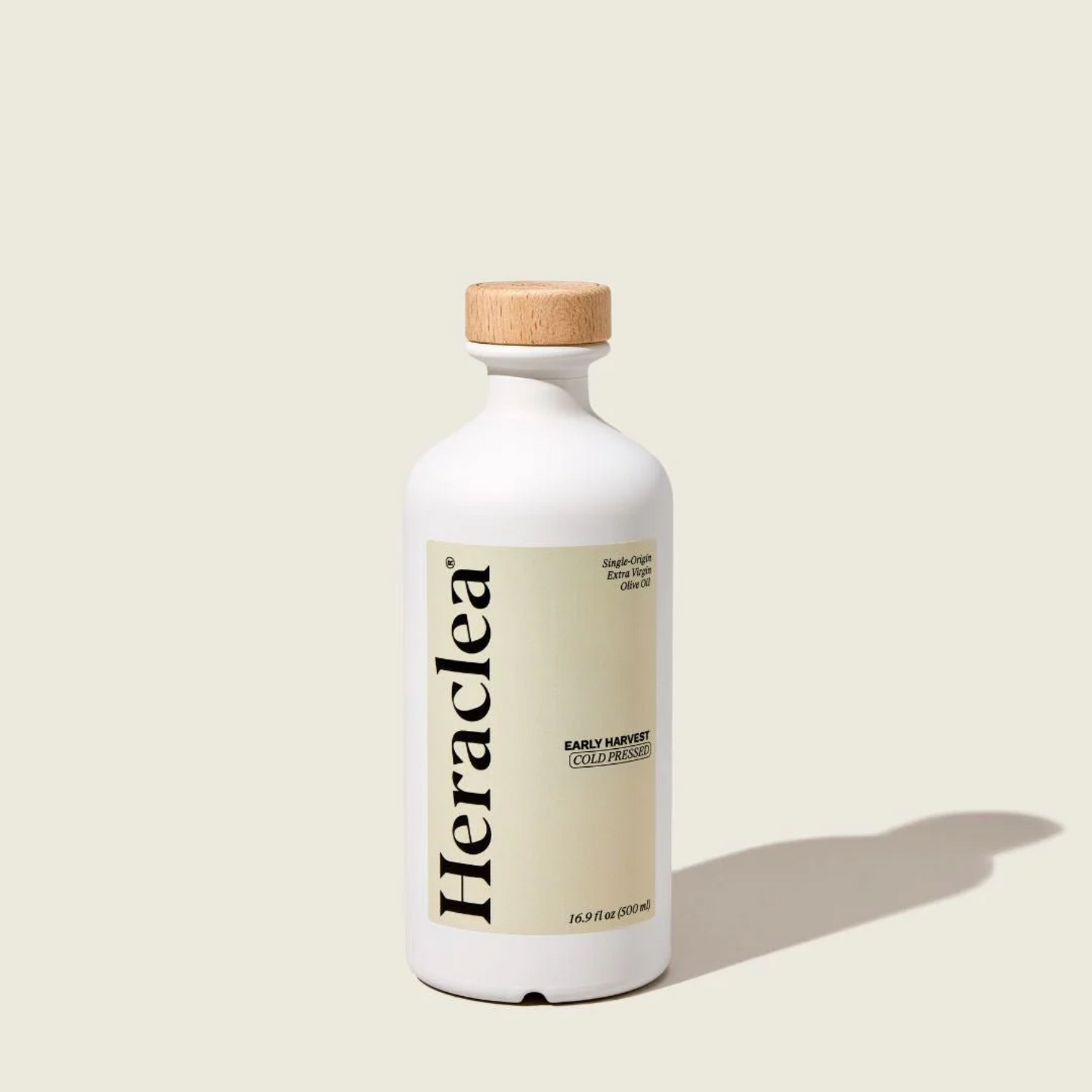 Bottle of Heraclea Early Harvest Extra Virgin Olive Oil—cold-pressed from unripe Memecik olives, featuring a grassy, spicy flavor. PDO-certified and family-made in Milas, Turkey.