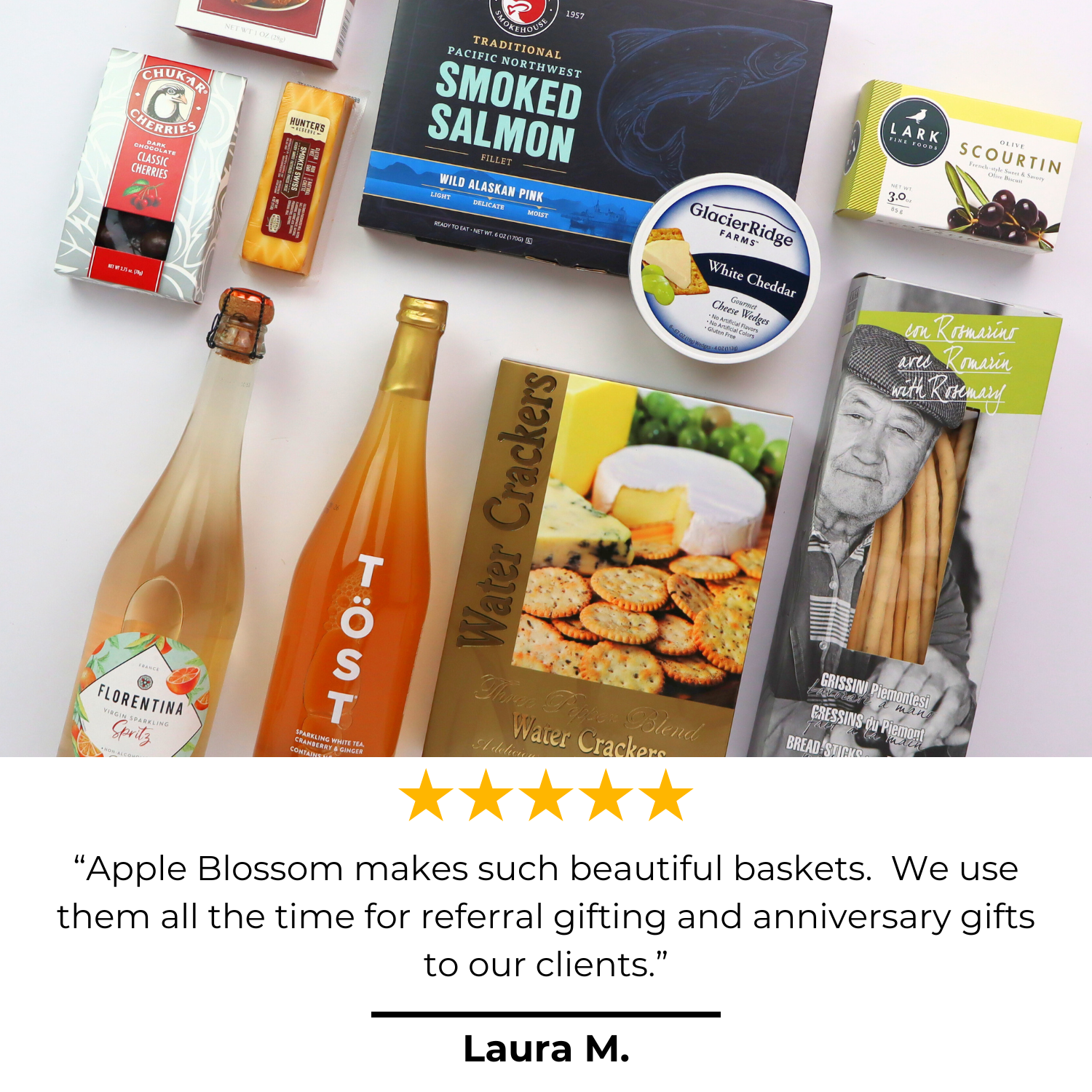 Non-Alcoholic Wine Basket with 5 star review that says “Apple Blossom makes such beautiful baskets.  We use them all the time for referral gifting and anniversary gifts to our clients