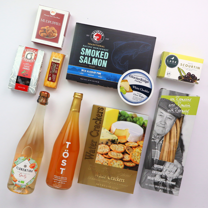 Non-Alcoholic Wine Basket flat lay of all of the products including sparkling white tea, smoked salmon, cheese, crackers, chocolate cherries, and cookies