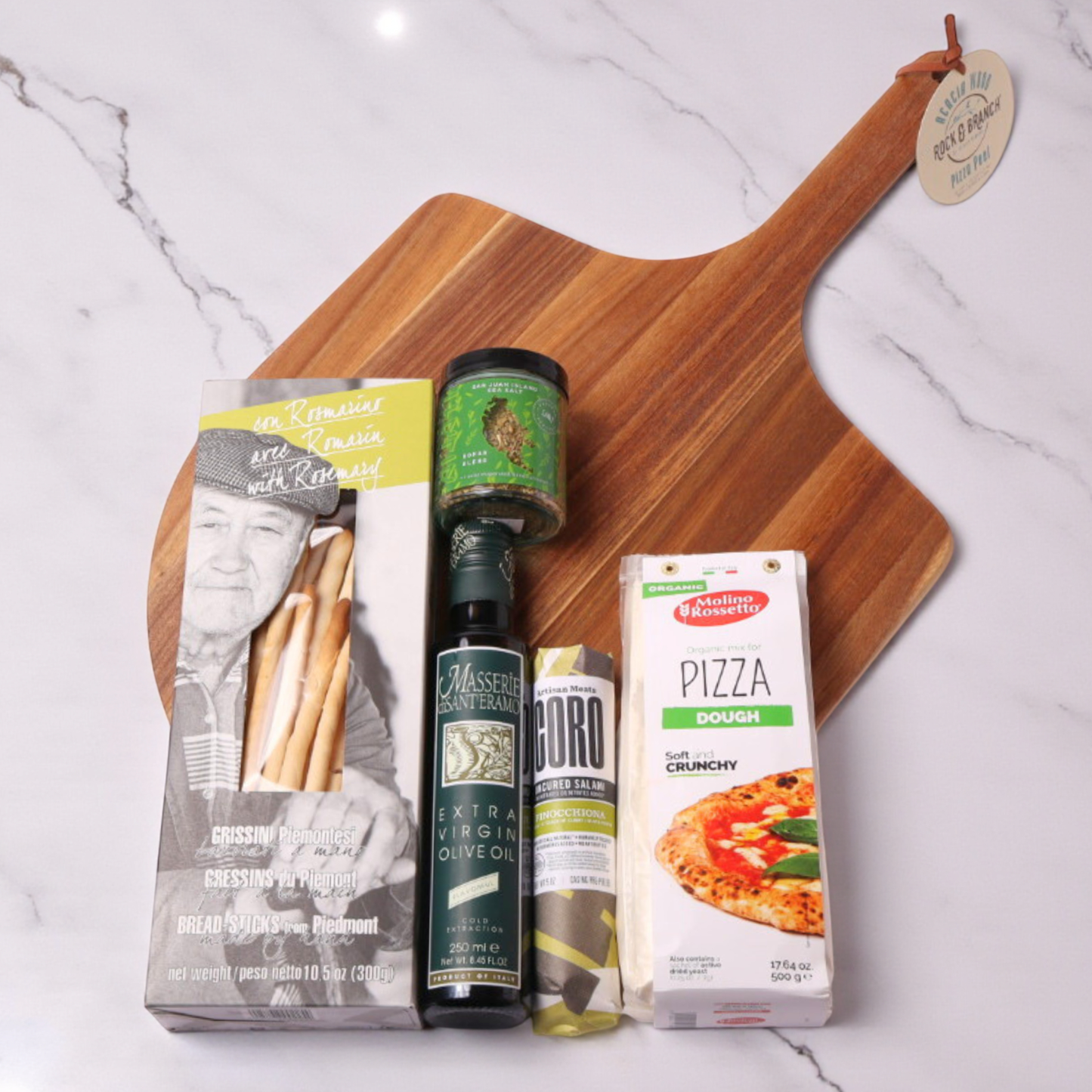 pizza night family gift set with pizza peel, olive oil, crackers, pizza dough, seasoning and salami