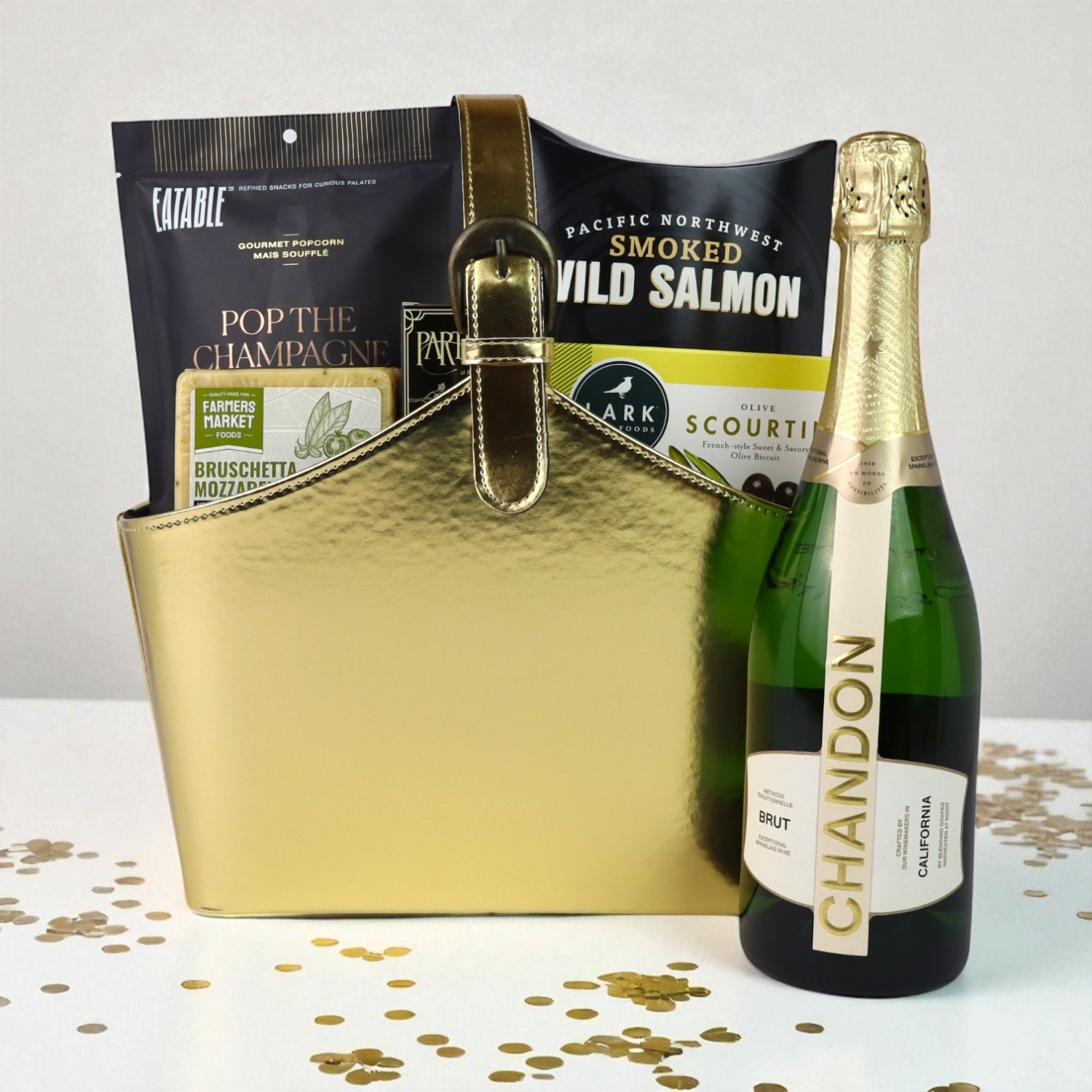 Luxury gold gift basket with Chandon Brut sparkling wine, Pacific Northwest smoked salmon, popcorn, and gourmet snacks — elegant Seattle gift option.