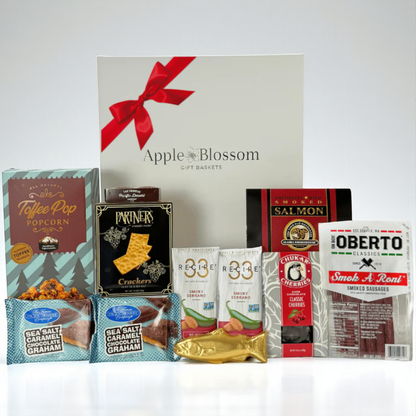 snack box filled with snacks made in WA.  The gift box includes: smoked salmon, pepperoni sticks, raosted nuts, crackers chocolate cherries and a solid chocolate salmon