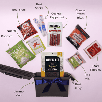 A top-down view of a men's snack gift basket displayed neatly, featuring beef jerky, nuts, popcorn, and savory snacks—perfect for a Father's Day gift, housewarming, or man cave essential.