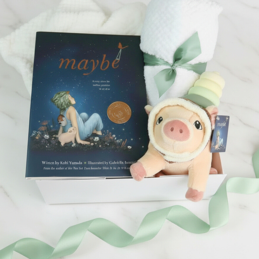 unisex baby gift set with Plush pig toy with a book titled 'maybe' on a white background