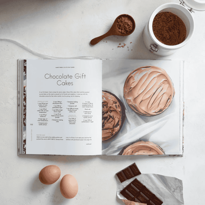 Baking For The Holidays cook book open to an example recipe of chocolate gift cakes