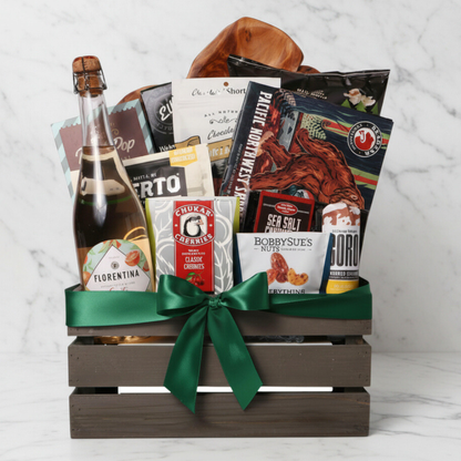 A beautifully curated Best of the Northwest gift basket filled with premium regional snacks, including smoked salmon, chocolates, nuts, and a bottle of Florentina spritz, elegantly wrapped in a wooden crate with a green ribbon.