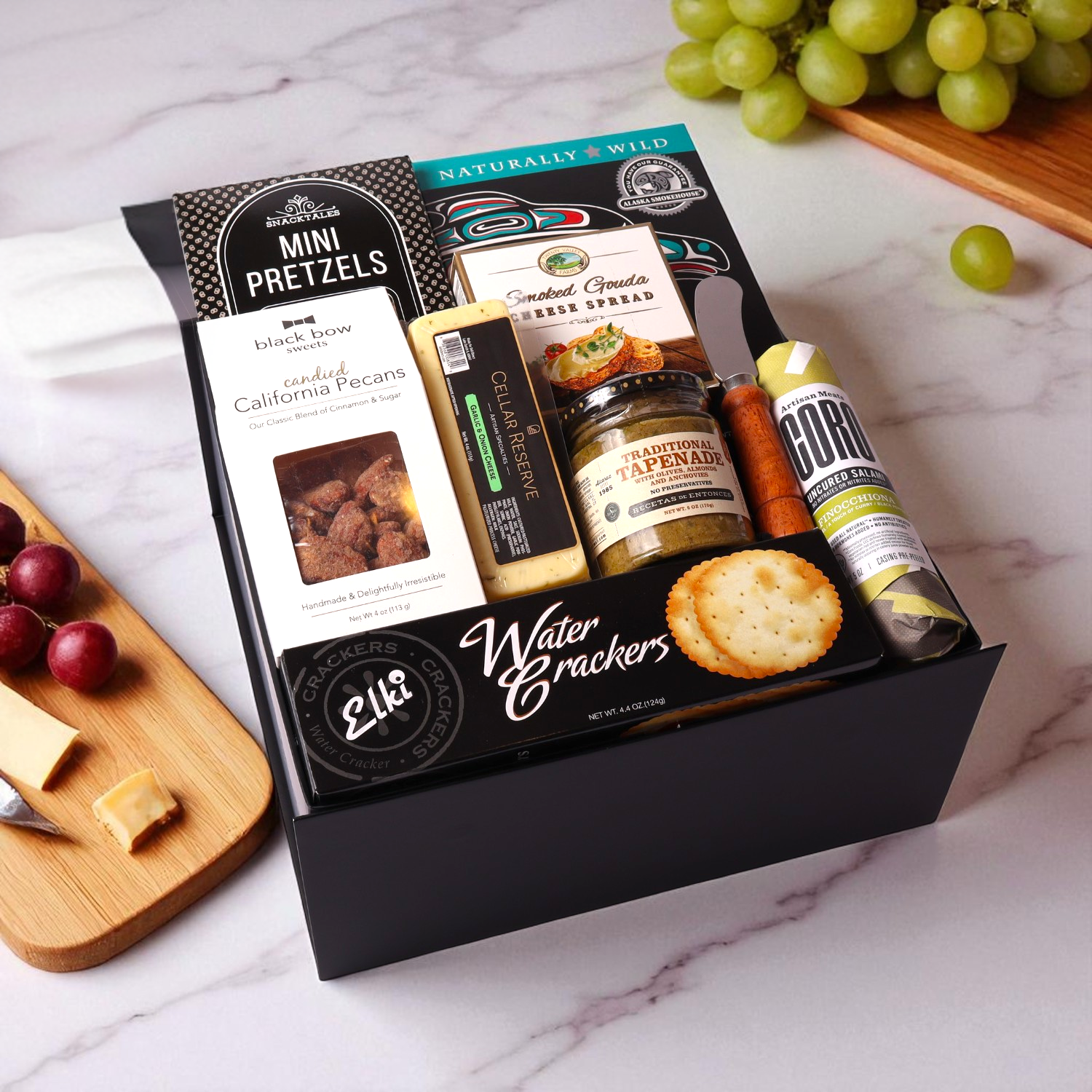 Charcuterie gift box made in WA, showcasing local Seattle flavors. Packed with meats, cheeses, and spreads, this is a perfect corporate gift or holiday gift basket for sharing and celebrating.