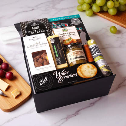 Charcuterie gift box made in WA, showcasing local Seattle flavors. Packed with meats, cheeses, and spreads, this is a perfect corporate gift or holiday gift basket for sharing and celebrating.