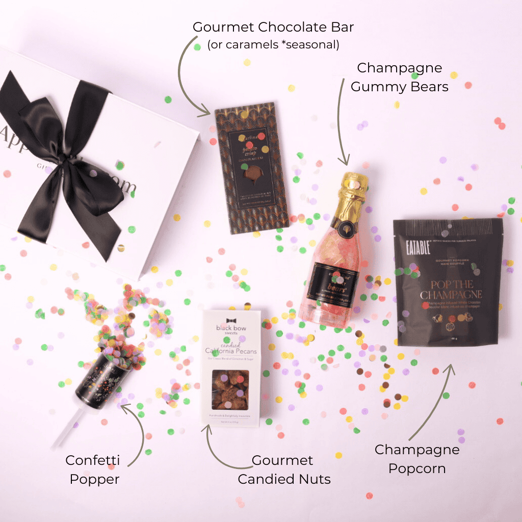 Flat lay of a luxury gift box with celebratory treats, perfect for gifting to friends, coworkers, or loved ones for any special moment.