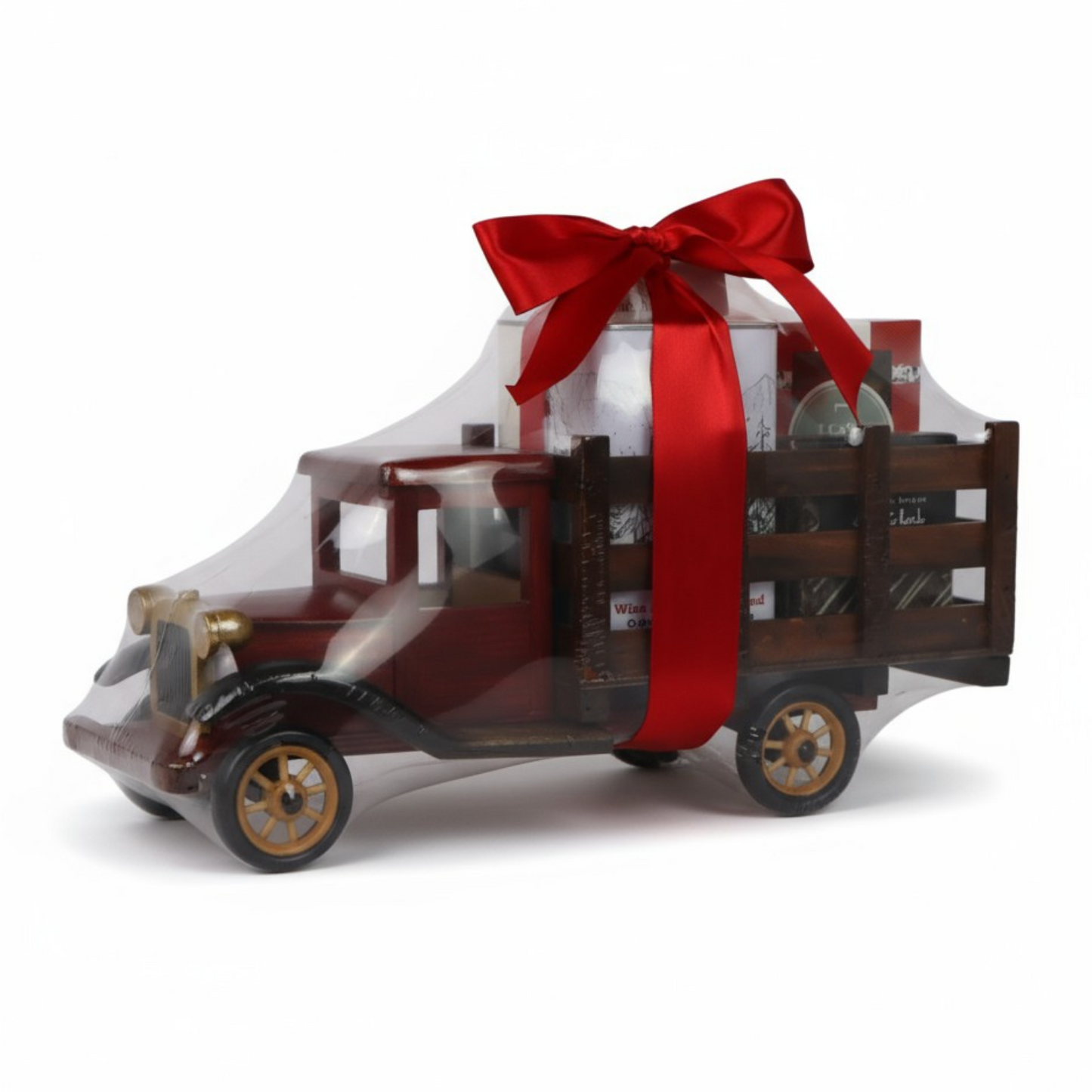 Unique gift basket in a vintage red truck filled with gourmet cookies and chocolates.