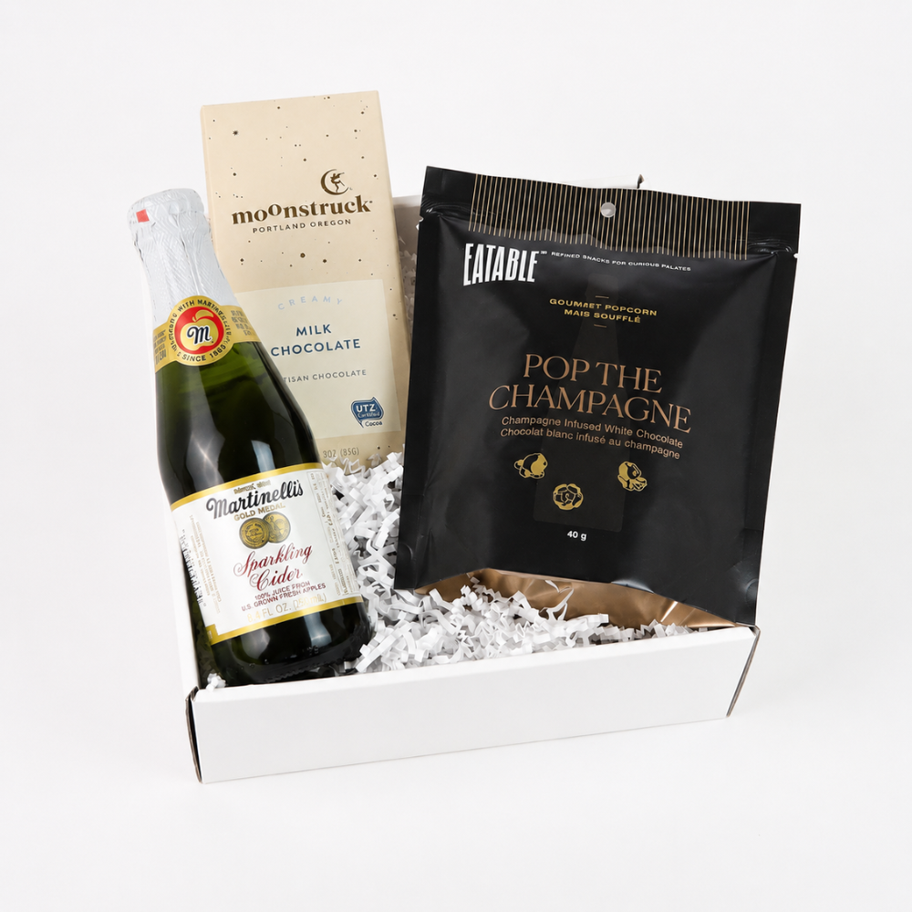 Celebrate Success client anniversary gift box with sparkling cider, champagne popcorn and chocolate