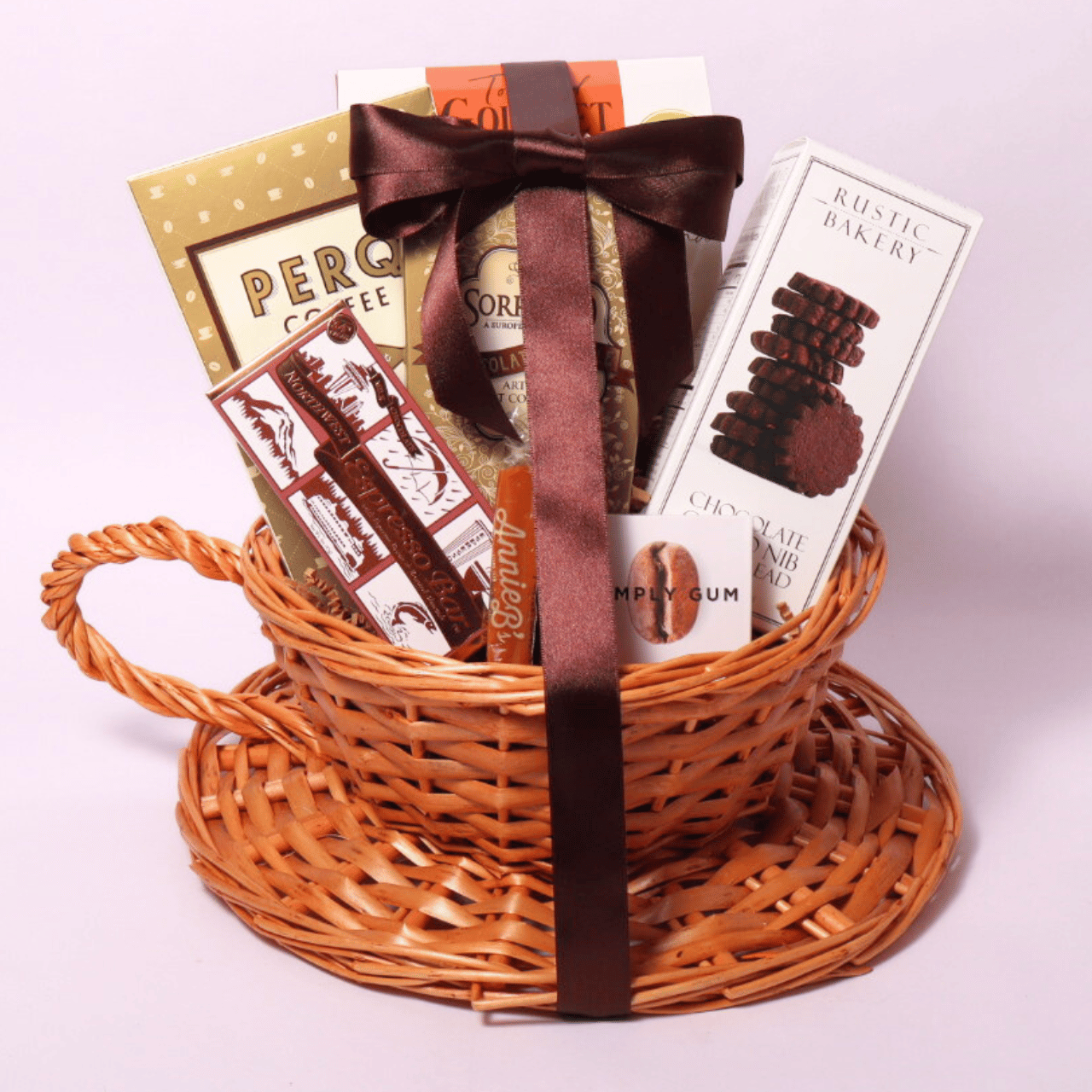 Coffee Lovers Gift Basket in a coffee cup-shaped basket, featuring gourmet coffee, chocolate treats, and mocha cookies—a perfect gift for coffee enthusiasts to enjoy their favorite flavors at home.