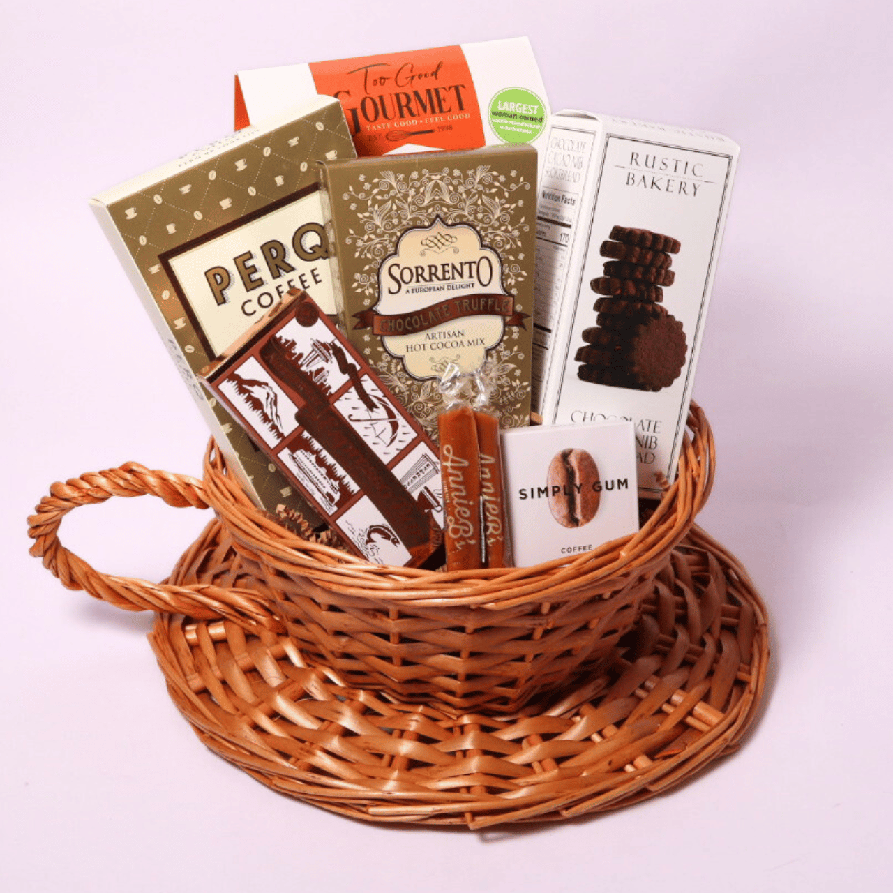 Coffee-themed gift basket in a unique coffee cup design, filled with premium ground coffee, caramel candies, mocha cookies, chocolate coffee bar, and more—a delightful present for coffee aficionados.