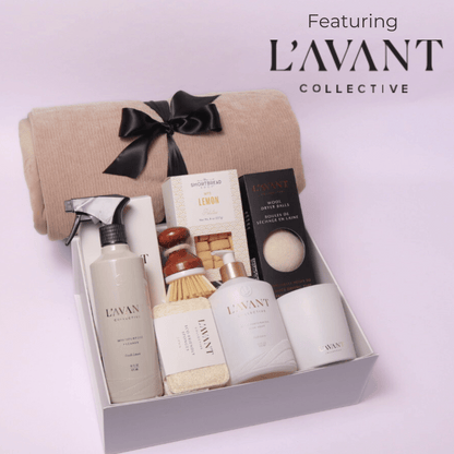 Luxury gift box featuring Seattle based Lavant collective luxury home products.  This luxury high end gift box includes: multipurpose cleaner, scrub brush, dish soap, candle, dryer balls, cookies and a luxe cream cozy throw.