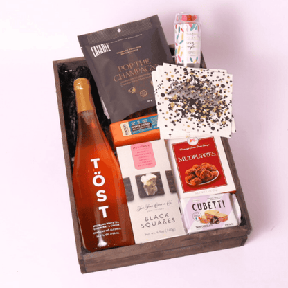 cue the confetti gift basket with  cookies, cheese, crackers, popcorn and party popper.  Made in WA by Apple Blossom Gift Baskets