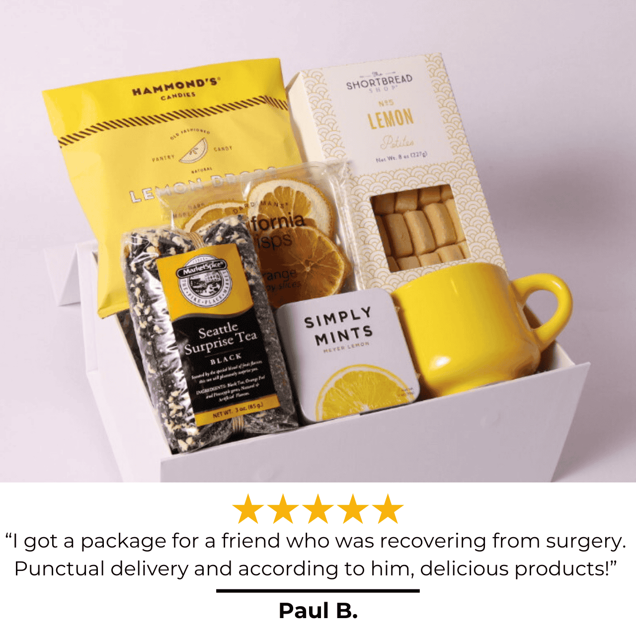 Image of the A Drop of Joy lemon-themed gift box with a glowing 5-star review, praising its beautiful presentation, delicious treats, and perfect fit for a care package, housewarming gift, or self-care gift box. A bright and cheerful way to send joy!