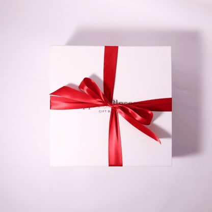 Elegant soft-touch gift box with magnetic closure and a festive red bow, perfect for Christmas gift baskets, client gifts, and holiday gift boxes. This luxurious box is designed for premium presentation, making it ideal for corporate gifts or employee appreciation gifts.