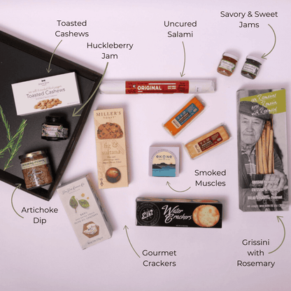 Locally sourced charcuterie snack gift set in an XL reusable wooden tray measuring 18" wide and 14" long, featuring Pacific Northwest treats like smoked muscles, artichoke dip, and savory jams—ideal for corporate events, holiday gifting, or client appreciation. Made in Seattle.