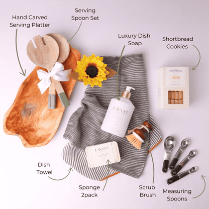 Flat Lay of Kitchen Gift Basket Items – A top-down view showcasing the elegant kitchen essentials, including handcrafted wooden utensils, premium dish soap, and eco-friendly cleaning tools, perfect for gifting.