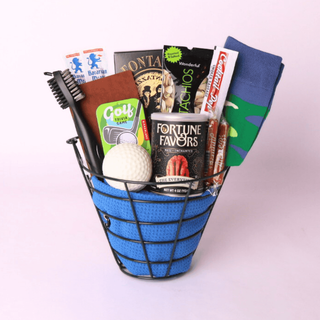 Seattle golf gift basket for him with golf socks, towel, cleaning tool, trivia game, pretzels, pistachios, and snacks by Apple Blossom Gift Baskets