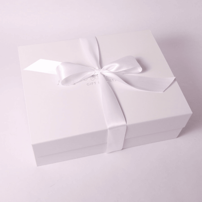 signature white soft touch luxury gift box with hand tied white satin bow made in Washington.