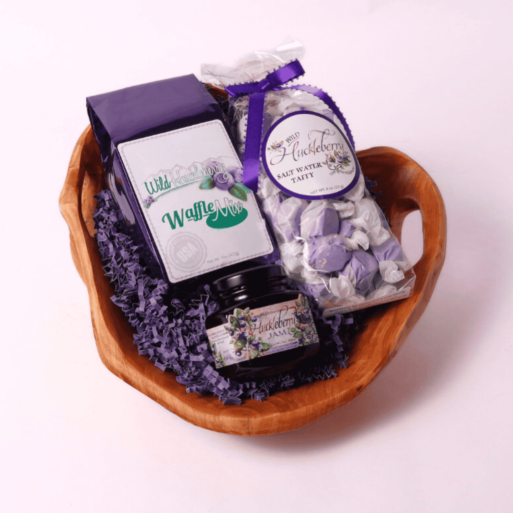 Luxury Washington Huckleberry Gourmet Gift Basket – A one-of-a-kind gift featuring a handcrafted wooden bowl filled with gourmet huckleberry treats. Ideal for food lovers, corporate gifting, and special occasions.