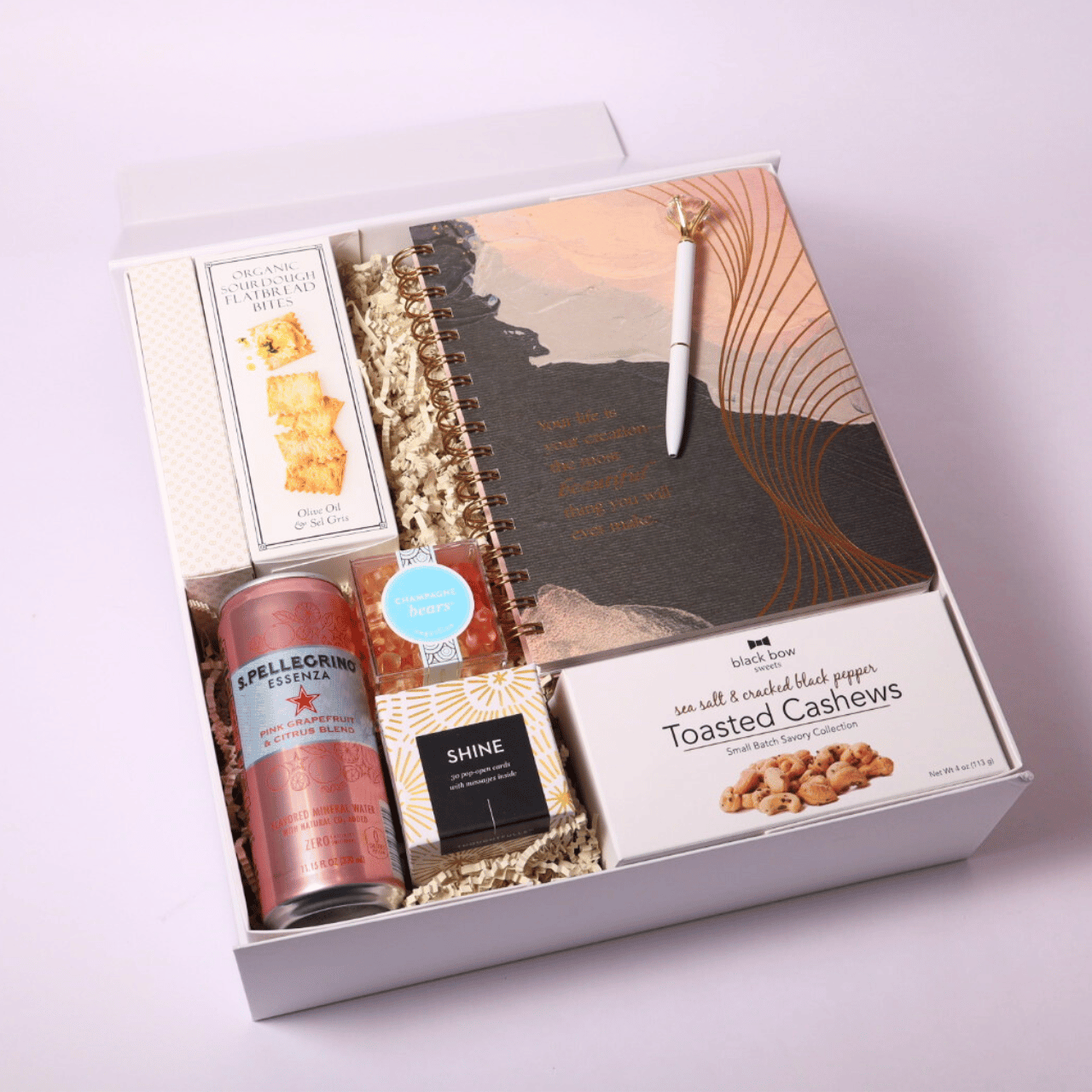 Unique self-care gift box with treats and a beautiful notebook, perfect for birthdays, celebrations, or to remind someone of their worth and creativity.