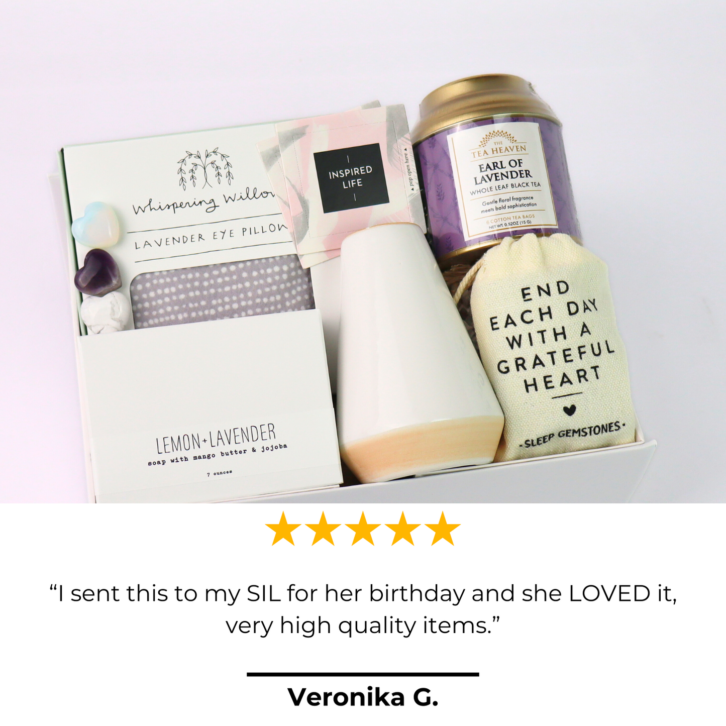 Gift set with lavender eye pillow, tea, and card on a white background.  Lavender Self-Care Gift Box with review card and product display, featuring tea, soap, and relaxation gifts