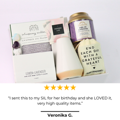 Gift set with lavender eye pillow, tea, and card on a white background.  Lavender Self-Care Gift Box with review card and product display, featuring tea, soap, and relaxation gifts