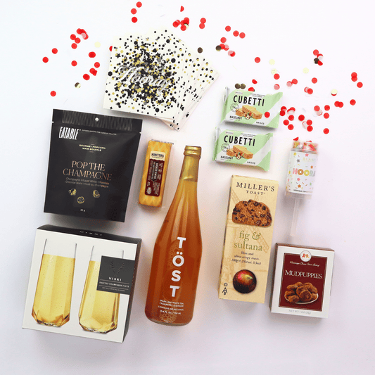 Lets Celebrate! Snack Gift Tray Lets Celebrate snack gift basket with non alcoholic drinks, cookies, cheese, crackers, party popper and champagne flutes  Apple Blossom Gift Baskets