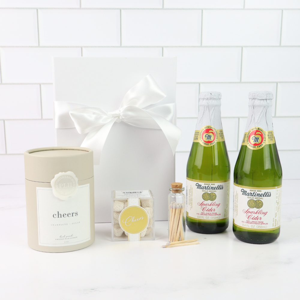 Seattle celebration gift basket with Martinelli’s sparkling cider, candles, and glassware