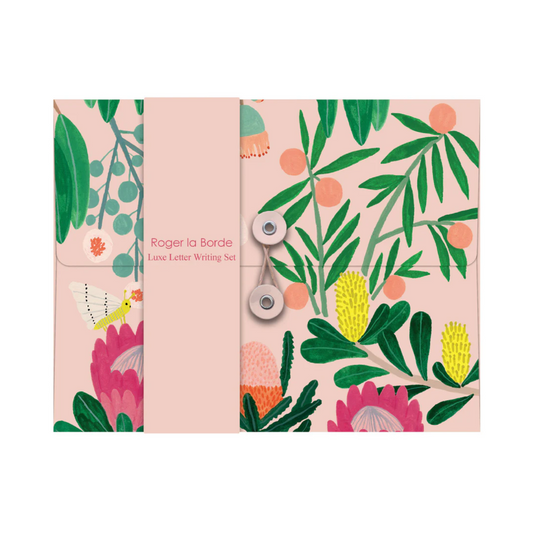 Letter writing set with floral design on a pink background
