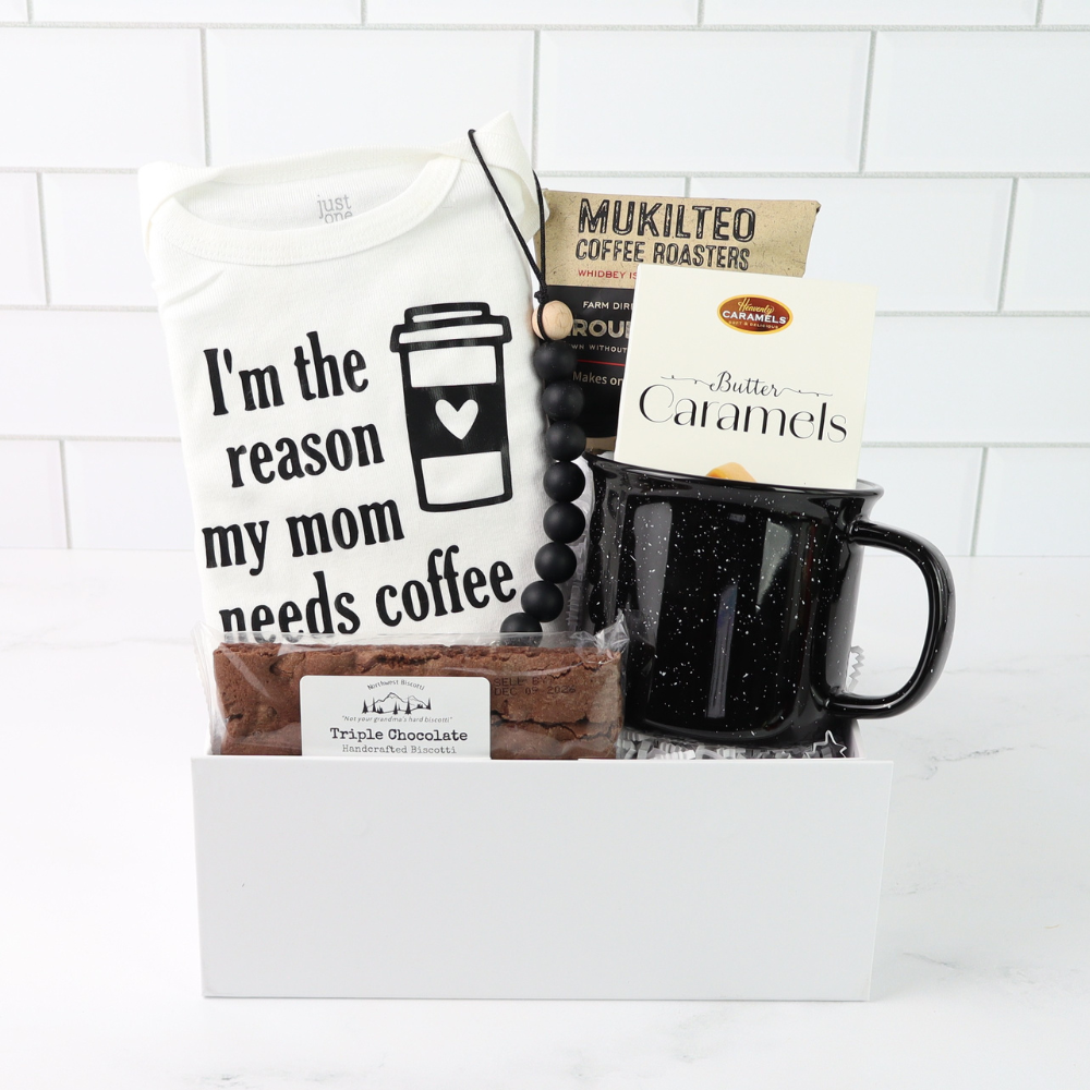 New mom coffee gift basket with baby onesie, ceramic mug, ground coffee, biscotti and caramels