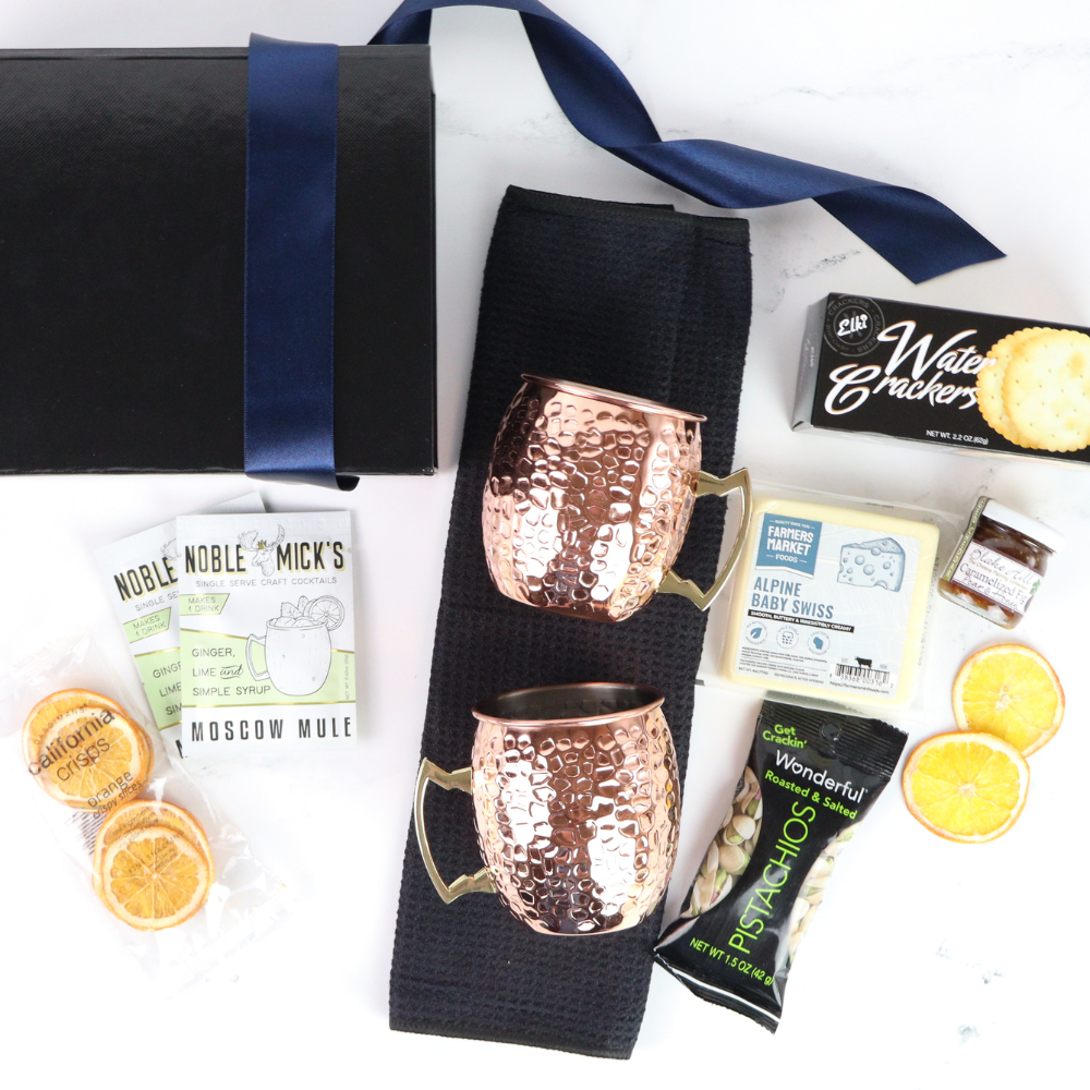 moscow mule Gift set with copper mugs, snacks, and a box on a white background
