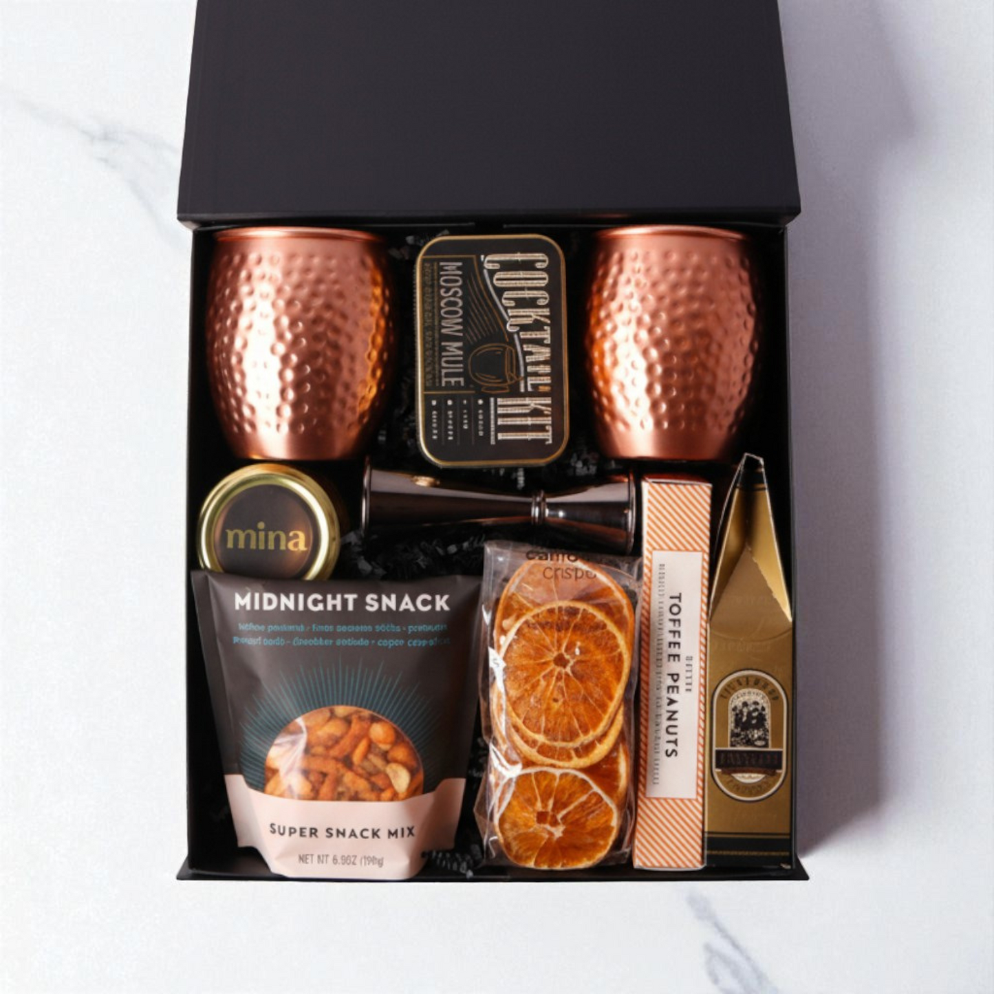 Moscow Mule Gift Box with copper mugs, slate coasters, and gourmet treats, including products made in WA. Ideal for client appreciation, birthdays, or a luxury gift for him.