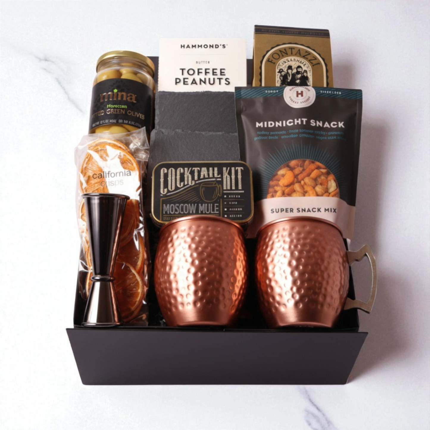 Elevate your gifting with our Moscow Mule Gift Box, complete with copper mugs, premium mixer kit, and Washington-made snacks. A unique and luxurious choice for client gifts or birthdays.