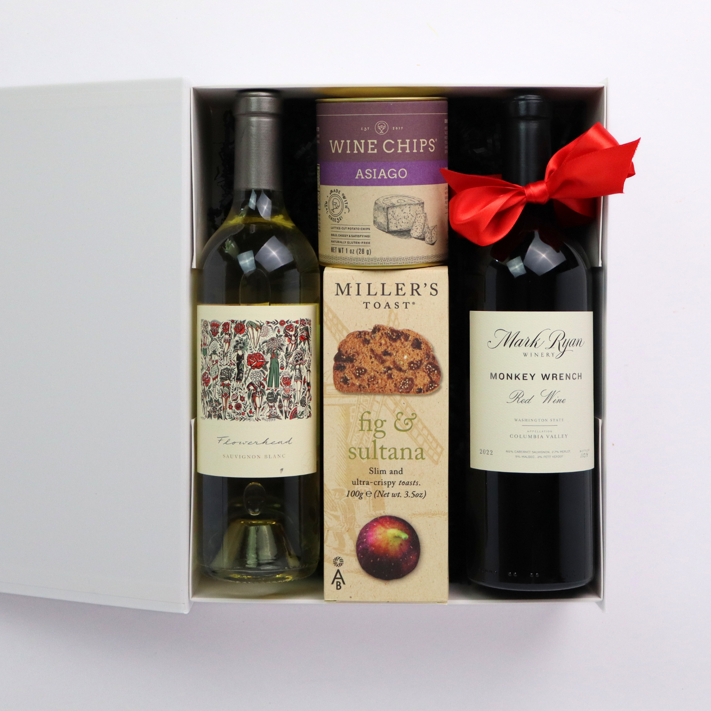 Northwest Elegance wine open gift box featuring Columbia valley Mark Ryan wine, wine chips, cheese, crackers, and chocolates.