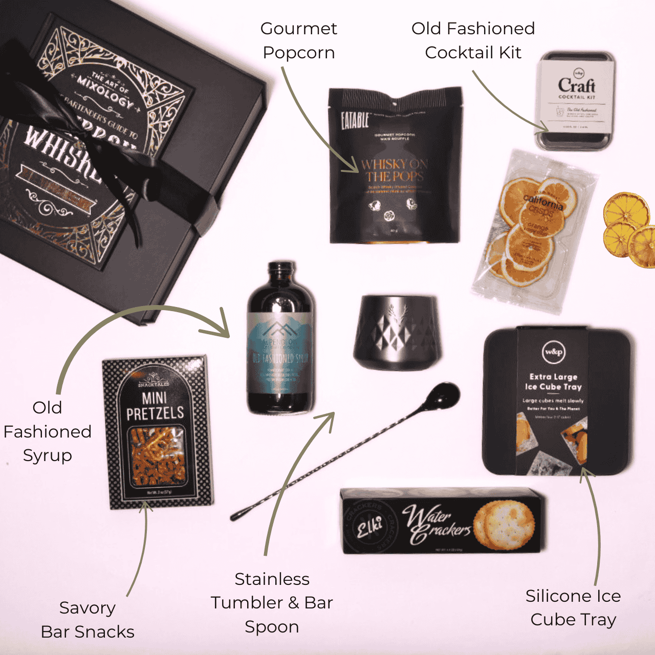 Flat lay of the old fashioned themed gift box contents, featuring Alpenglow Old Fashioned Cocktail Syrup handcrafted in Washington, alongside infused popcorn, a tumbler, ice mold, cocktail kit, and more.