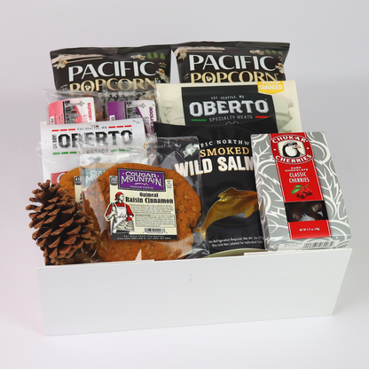 Close-up of Pacific Northwest gift basket featuring a curated selection of seattle's best chocolate bar, oberto jerky, cougar mountain cookies, chukar cherries and smoked salmon from the Pacific Northwest